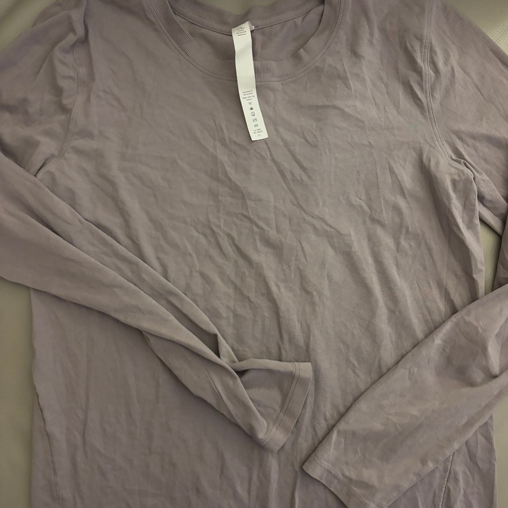 Lilac long sleeve lululemon shirt never worn size 4